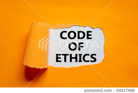 Code of ethics symbol. Words 'Code of ethics' appearing behind torn orange paper. Beautiful orange background. Business, code of ethics concept, copy space. 89837986