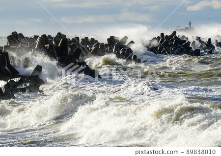 Storm in the Baltic Sea, waves hitting the breakwater concrete tetrapods Storm in the Baltic Sea, waves hitting the breakwater concrete tetrapods 89838010