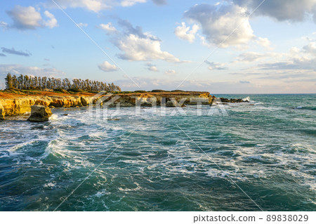 A beautiful Mediterranean bay with turquoise blue waters and a rocky coastline in Cyprus A beautiful Mediterranean bay with turquoise blue waters and a rocky coastline in Cyprus 89838029