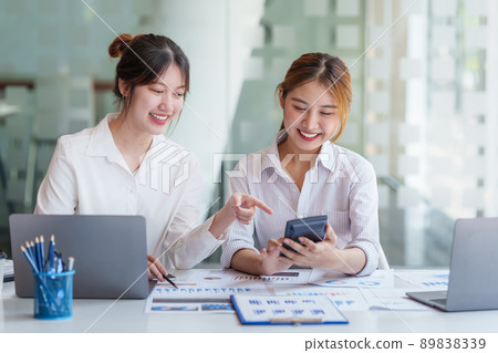 Analytics intelligence concept. Group of business people discuss current financial and economic on laptop for investment at the meeting.. Analytics intelligence concept. Group of business people discuss current financial and economic on laptop for investment at the meeting.. 89838339