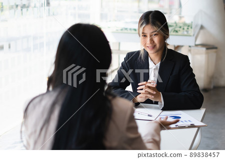 During a job interview, HR managers look for a good new employee. Manager have positive first impression of candidate. During a job interview, HR managers look for a good new employee. Manager have positive first impression of candidate. 89838457