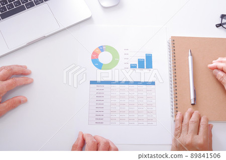Senior couple reviewing household budget Senior couple reviewing household budget 89841506