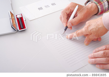 Senior couple writing a testamentary will Senior couple writing a testamentary will 89841695