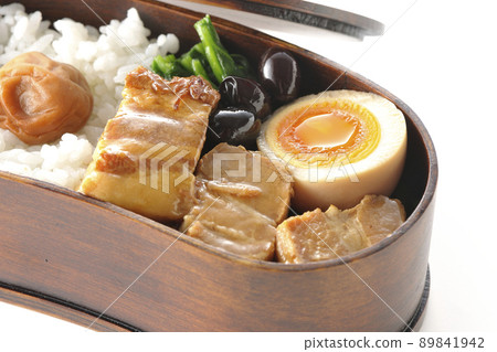 Kakuni bento with magewappa, black beans, spinach, and soft-boiled eggs taken on a white background Kakuni bento with magewappa, black beans, spinach, and soft-boiled eggs taken on a white background 89841942