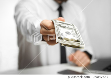 Take your money! Portrait of richman investor big boss in white shirt and black tie are sitting in office giving your a lot of money, your bonus, isolated, indoor, focus, studio shot, Take your money! Portrait of richman investor big boss in white shirt and black tie are sitting in office giving your a lot of money, your bonus, isolated, indoor, focus, studio shot, 89842857
