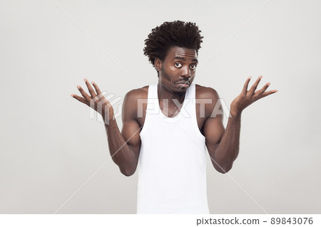 Emotional afro man have a confused look. Studio shot. Gray background Emotional afro man have a confused look. Studio shot. Gray background 89843076