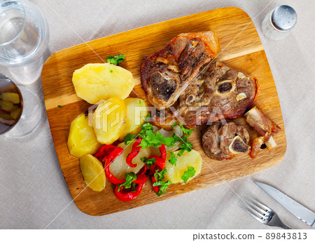 Dish of lamb leg with potatoes and pepper Dish of lamb leg with potatoes and pepper 89843813