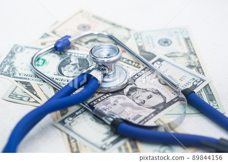 A stethoscope on messy dollars 89844156