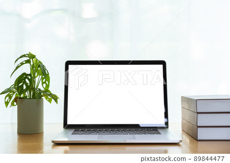 Isolated laptop computer screen with clipping path, minimal modern style of workspace at home with laptop computer, books, and decorate plant. 89844477