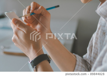 A student taking a note A student taking a note 89844828