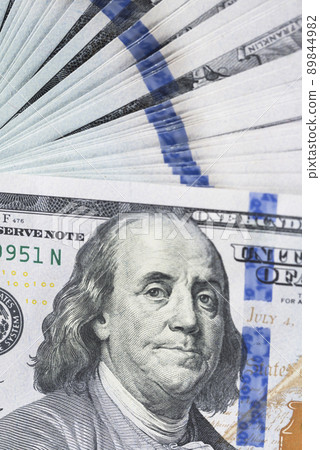 A lot of dollar bills on a white background A lot of dollar bills on a white background 89844982