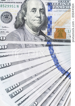 A lot of dollar bills on a white background 89844984