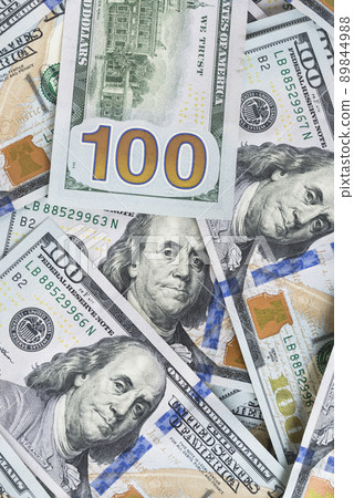 A lot of dollar bills on a white background 89844988
