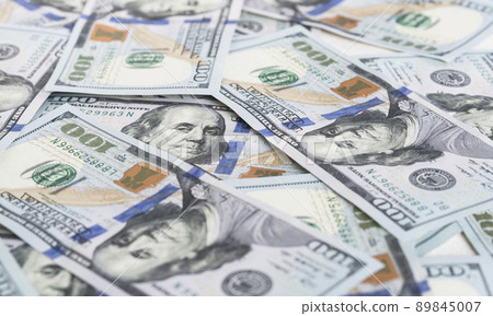 A lot of dollar bills on a white background A lot of dollar bills on a white background 89845007