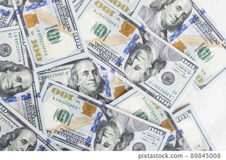 A lot of dollar bills on a white background 89845008