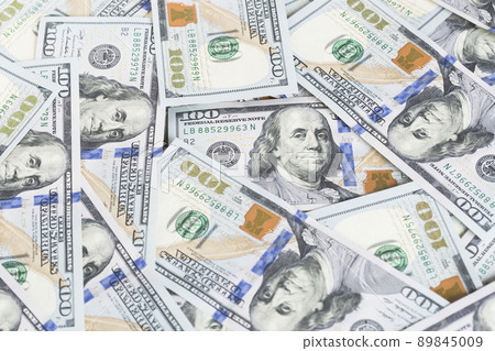 A lot of dollar bills on a white background A lot of dollar bills on a white background 89845009