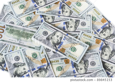 A lot of dollar bills on a white background 89845153