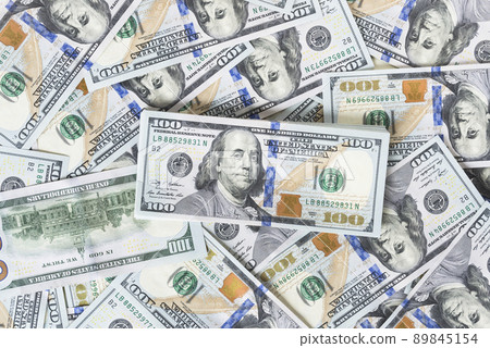 A lot of dollar bills on a white background 89845154