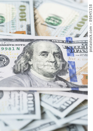 A lot of dollar bills on a white background A lot of dollar bills on a white background 89845158