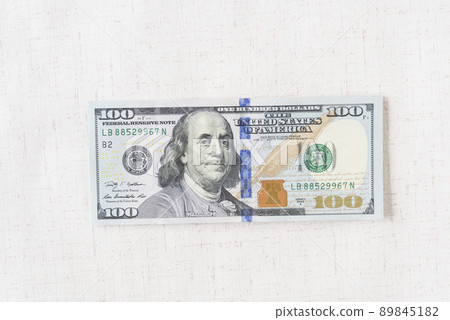 A lot of dollar bills on a white background 89845182