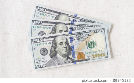 A lot of dollar bills on a white background 89845183