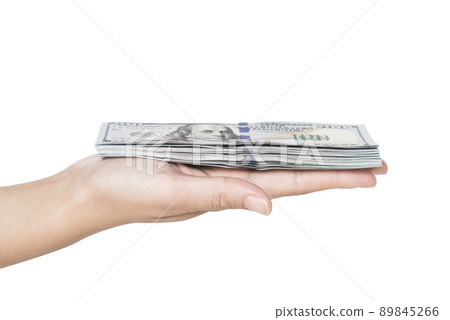 Hand holding a stack of dollars isolated on white background 89845266