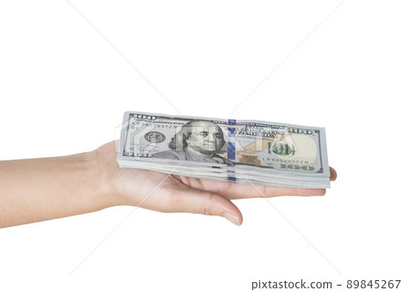 Hand holding a stack of dollars isolated on white background Hand holding a stack of dollars isolated on white background 89845267