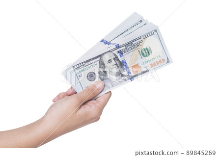 Hand holding a stack of dollars isolated on white background Hand holding a stack of dollars isolated on white background 89845269