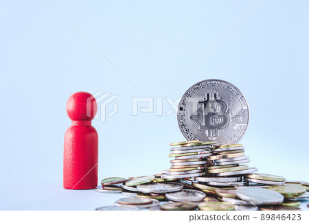 Bitcoin BTC Cryptocurrency Coins. Stock Market Concept. Exchange bitcoin cash for a money. Cryptocurrency on coins and wooden man. Digital modern method of payment. Savings, investments concept 89846423