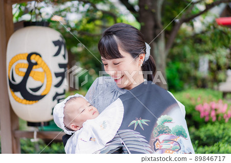 Mom hugging her baby outside Mom hugging her baby outside 89846717