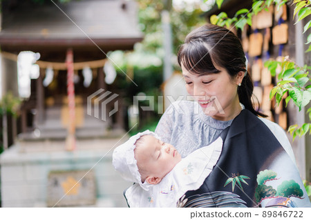 Mom hugging her baby outside Mom hugging her baby outside 89846722