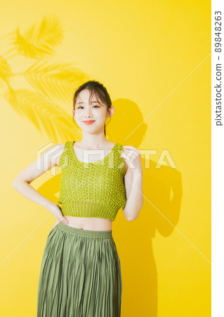 Summer woman yellow background 89848263