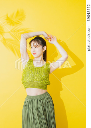 Summer woman yellow background Summer woman yellow background 89848352