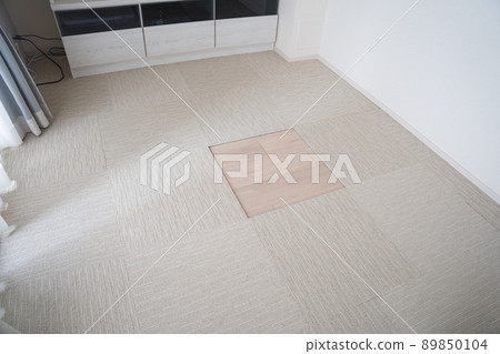 Living room with only one tile carpet missing 89850104