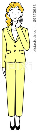 A cute woman in a suit who is positively thinking about a decision while touching her face. 89850688