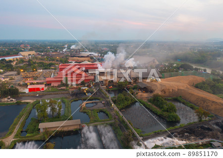 Aerial view of factory industry with smoke and toxic air from chimney in energy and pollution environment concept with city town landscape background. 89851170