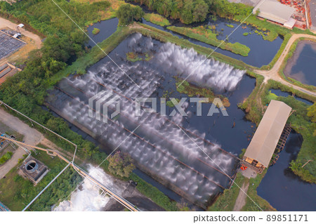 Aerial view of factory industry with smoke and toxic air from chimney in energy and pollution environment concept with city town landscape background. 89851171
