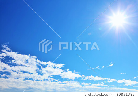 Summer blue sky, white clouds and the sun 89851383