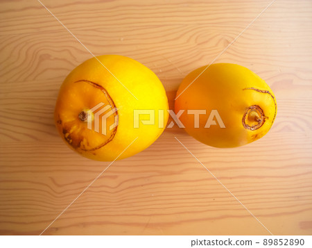 Yellow melon, melon and squash on a wood table 89852890