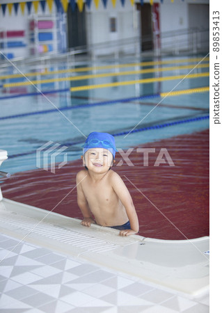 Boys swimming in the pool 89853413