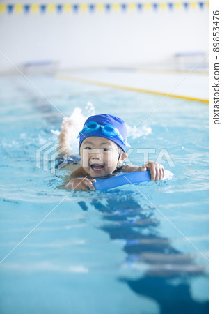 Boys swimming in the pool Boys swimming in the pool 89853476