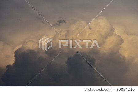 Dramatic sky clouds in shadow background Dramatic sky clouds in shadow background 89854210