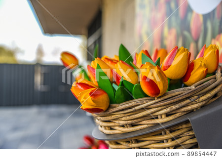 Lisse, Netherlands, April 2022. Clogs and wooden tulips, souvenirs of Holland. Lisse, Netherlands, April 2022. Clogs and wooden tulips, souvenirs of Holland. 89854447