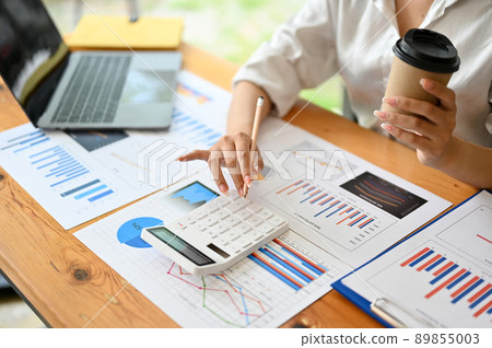 Female financial analysts calculating a financial investment report. close-up image 89855003