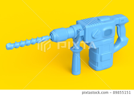 Electric drill with cord and attached metal bit for repair on yellow monochrome Electric drill with cord and attached metal bit for repair on yellow monochrome 89855151