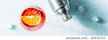 Aperol cocktail with an orange and a shaker panorama, Italian drink 89856103