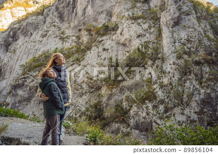 Mom and son tourists in the background of Beautiful Canyon of Moraca river in winter, Montenegro or Crna Gora, Balkan, Europe 89856104