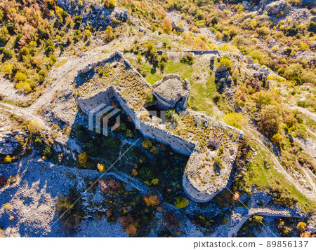 Collapsing tower of fortress Kosmac. Ancient Austro-Hungarian fortress built as a defensive structure and an observation post. Montenego Collapsing tower of fortress Kosmac. Ancient Austro-Hungarian fortress built as a defensive structure and an observation post. Montenego 89856137