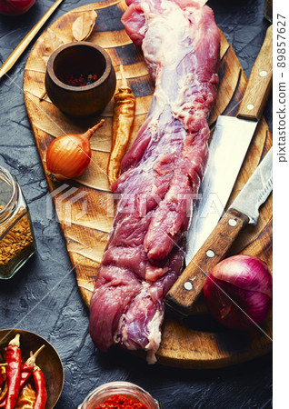 Fresh raw pork tenderloin. 89857627