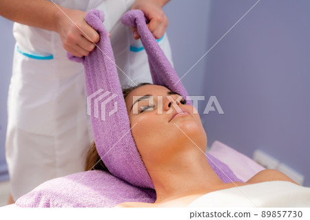 Relaxing massage. European woman getting head massage in spa salon, side view 89857730